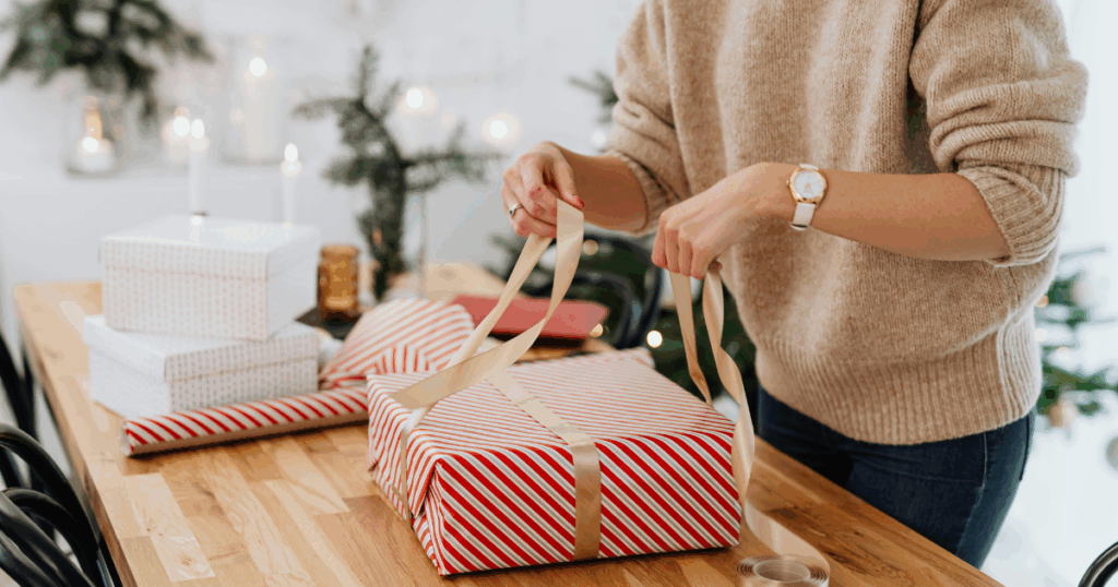 lady wrapping christmas gift