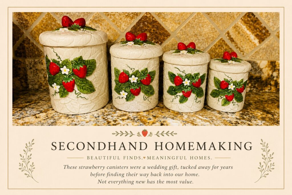 Vintage strawberry canisters displayed in a kitchen as treasured decor collected over many years.
