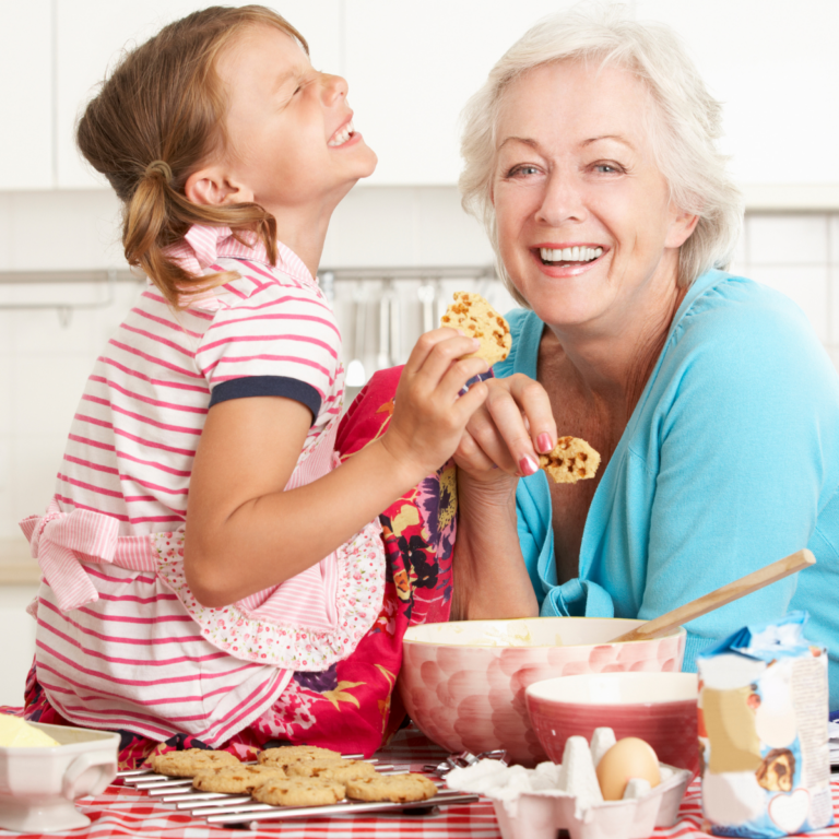 grandmother baking cookies with granddaughter