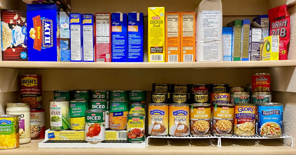 Stocked home pantry with canned goods and staples to use before buying more groceries